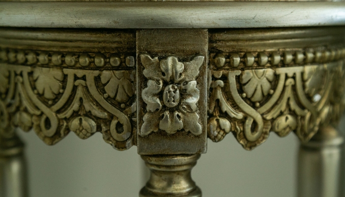 Closeup of carved details on vintage coffee table