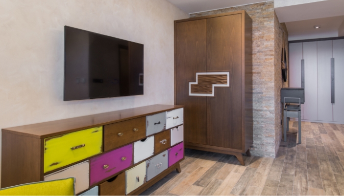 A shabby-chic dresser used as part of an entertainment center