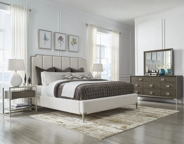 front view of a modern white bedroom with a white upholstered headboard