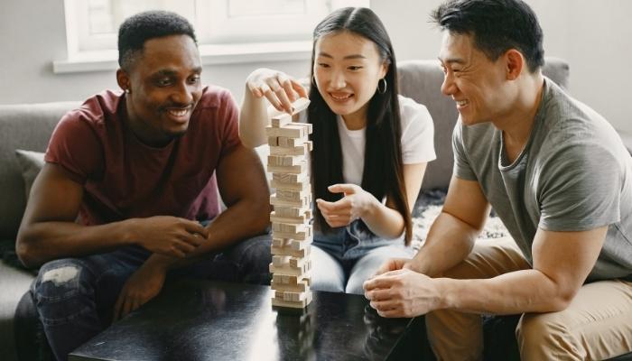 Adults playing Jenga