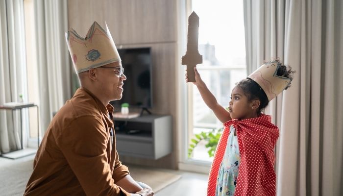 Father and daughter playing dress up