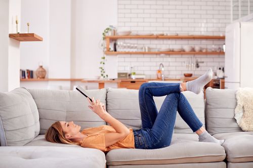 Woman Laying on a Couch