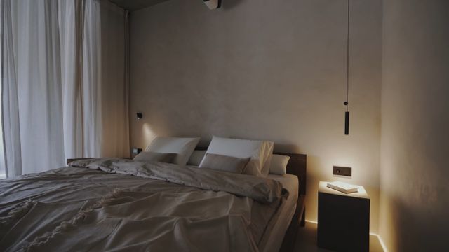 Front view of a minimal romantic dimly lit bedroom