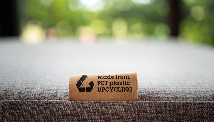 Furniture with fabric tab that says it was made from recycled plastic