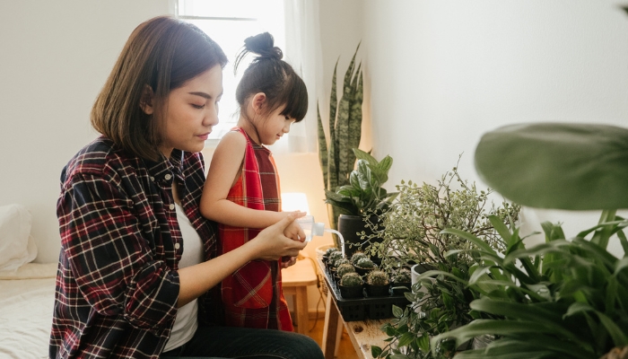 Woman and child gardening indoors