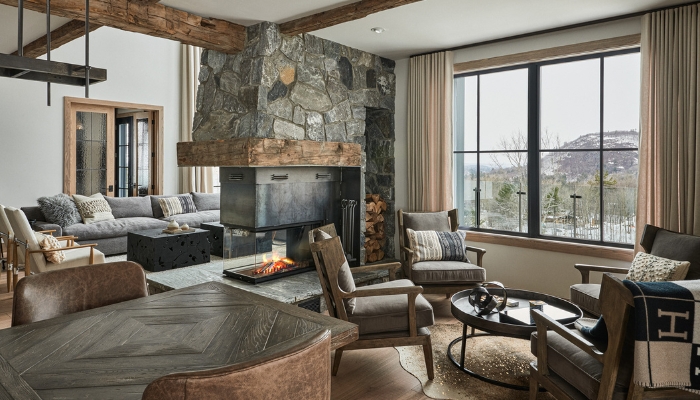 Living room with farmhouse chic design with stone and bronze accents
