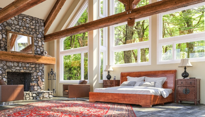 Farmhouse chic designed bedroom with exposed ceiling beams