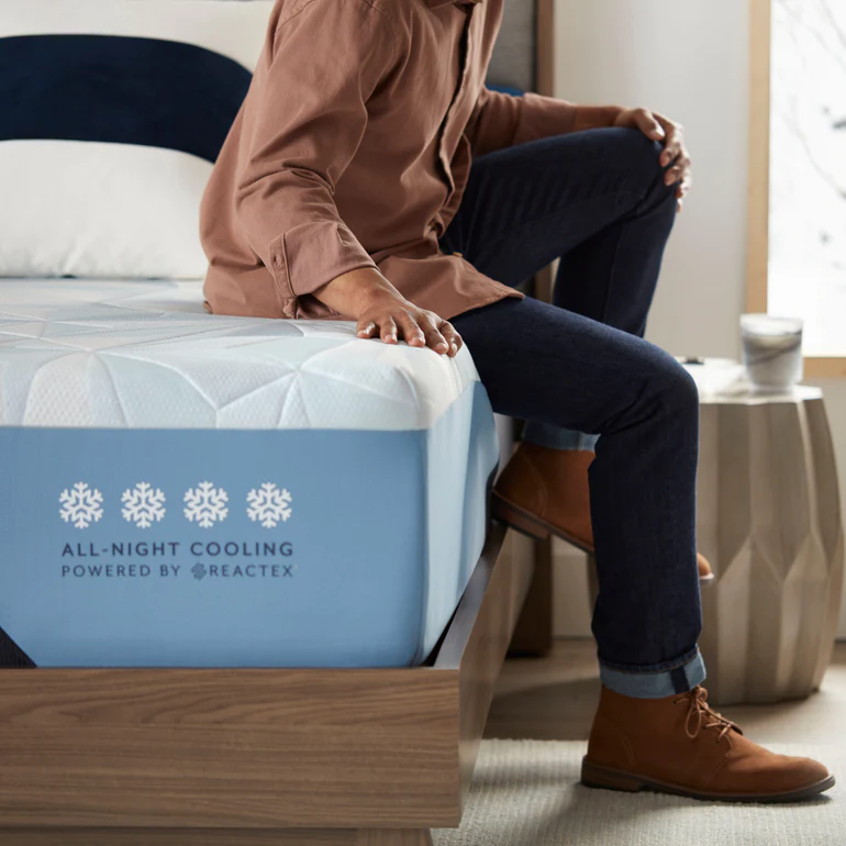Person sitting on new serta arctic mattress