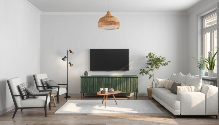 A neutral living room with a green entertainment center at the focal point.