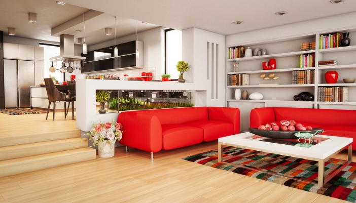 A modern living room with bold red couches.