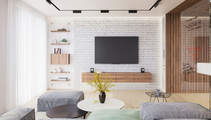 A modern living room with a TV as the focal point.