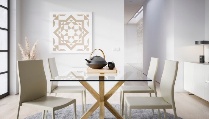 A glass dining table in a modern dining room with white and wooden accents.