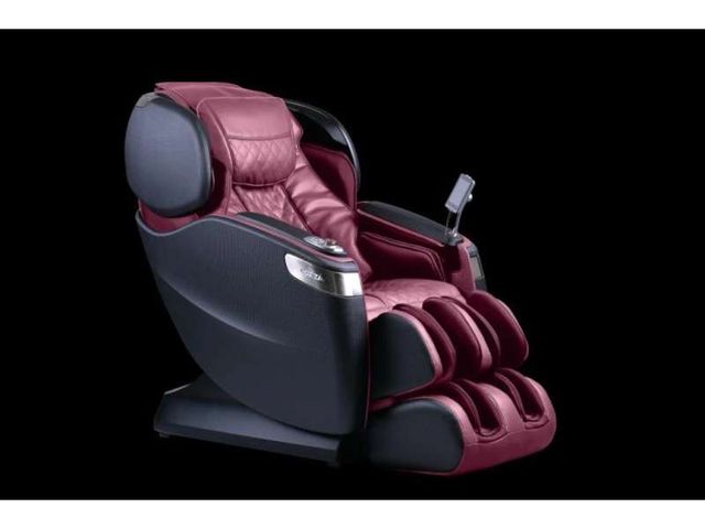 front view of a red Cozzia massage chair on a black background