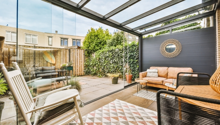 Outdoor lounge area situated close to al fresco dining area