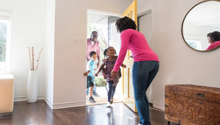 Kids coming home to mom, featuring a bench in the entryway