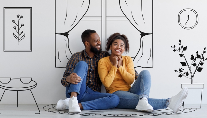 Couple planning out their living room arrangement