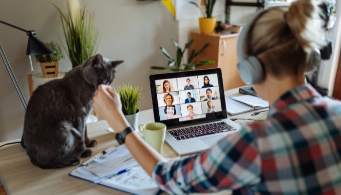 Woman working from home at her desk in the middle of a zoom call