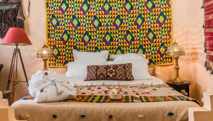 A bedroom with bold geometric patterns