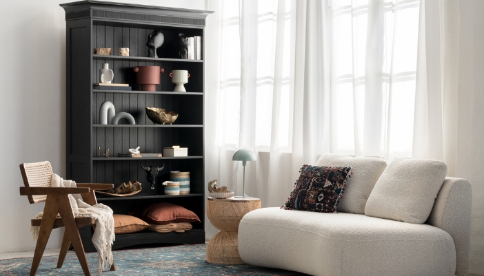 A spacious living space with a big bookcase