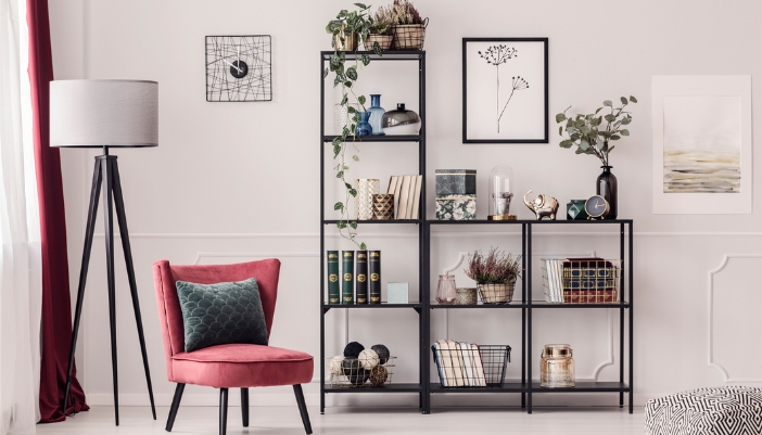 An etagere bookcase displaying decor