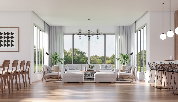 a home with a matching living room set, dining set, and kitchen bar stools