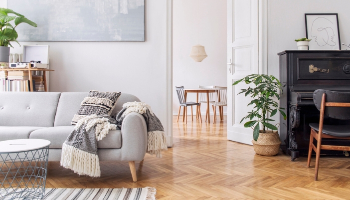 A modern Scandinavian living room with neutral colors.