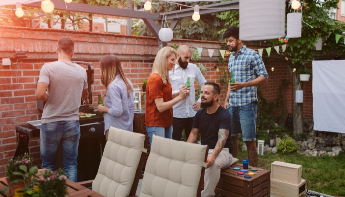 Friends hanging out in back patio for BBQ