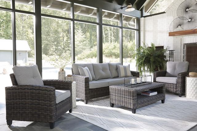 Front view of an indoor patio set against a large window wall