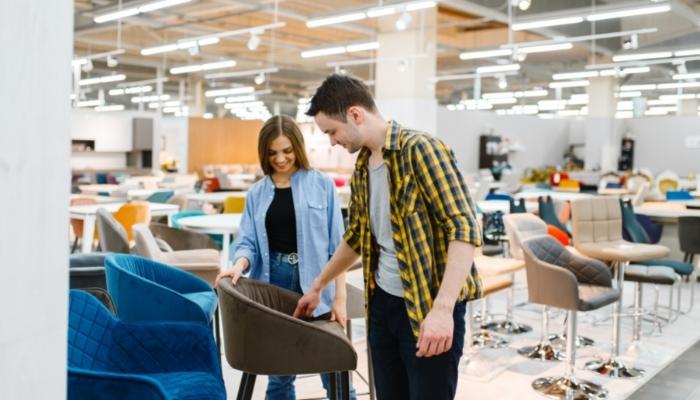 Couple looking at timeless chair