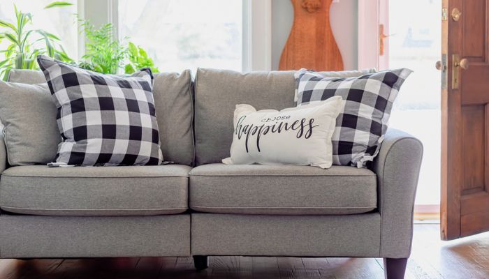 farmhouse style interior with pillow that says choose happiness