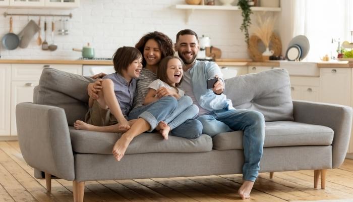 happy family on sofa at home