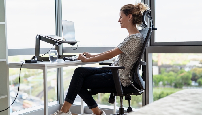 Woman working from home in an ergonomic chair