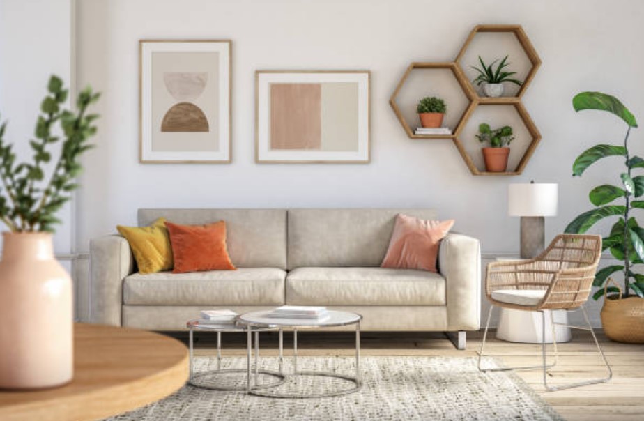 boho living room with couch, plants, a chair, and a nesring table