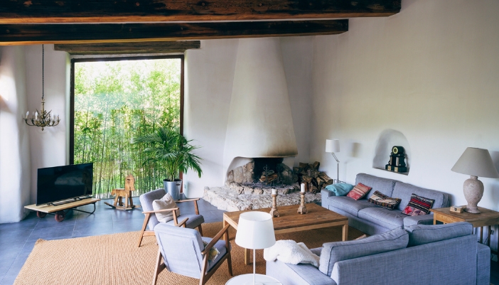 A wellness-centered room with soft cushions and textured rug