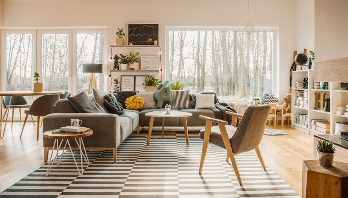 An open concept living room with natural wood accents and a warm lighting.