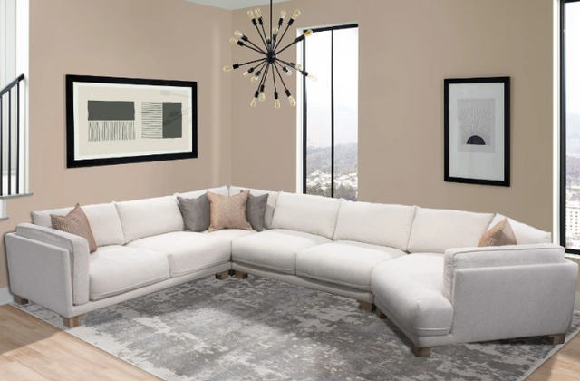 view of a white contemporary curved sectional sofa in a modern home