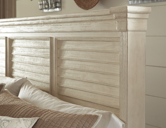 close view of a whitewashed engineered wood king bed frame headboard