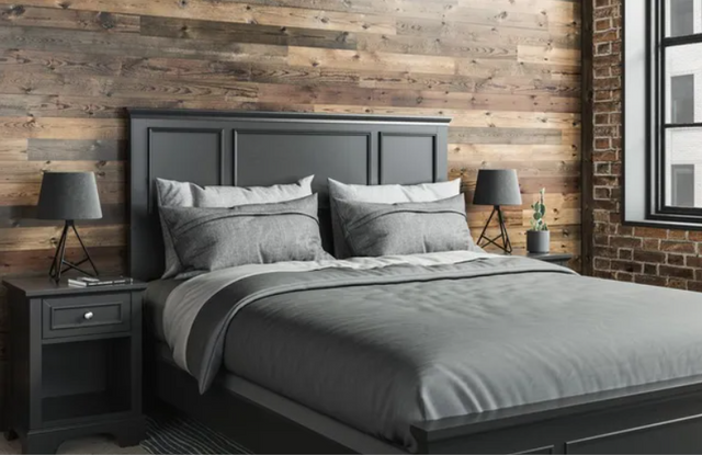 front view of a black bed frame and black furniture in a rustic bedroom