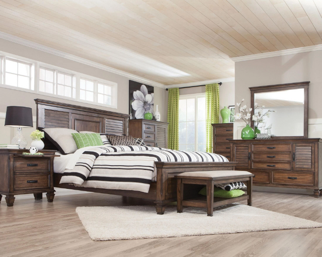 front view of a transitional bedroom with the Coaster® Franco 5-Piece Burnished Oak King Bedroom Set
