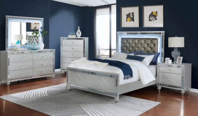 front view of a modern bedroom with the Coaster® Gunnison 5-Piece Silver Metallic Eastern King Bedroom Set with LED Lighting