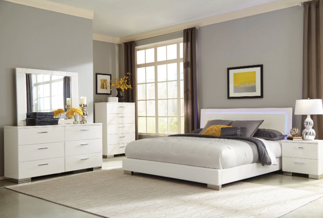 front view of a modern minimalist bedroom with a white furniture set