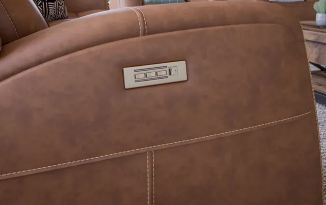 side view of a faux leather sofa with an electric recliner control panel on the side