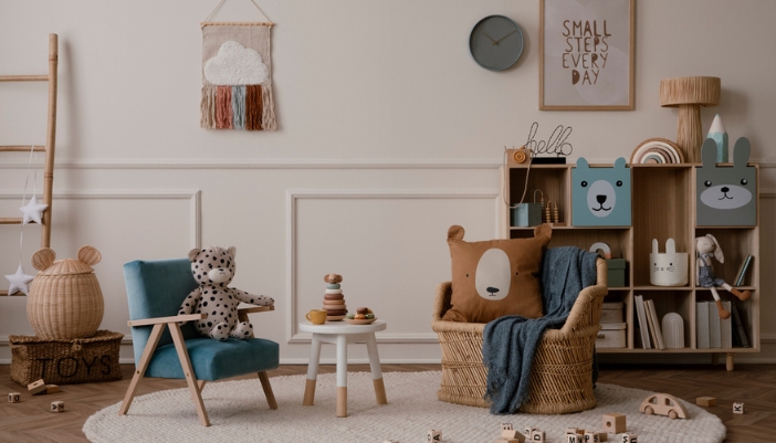 A close-up of an interior children’s playroom with cubbies to organize toys and books.