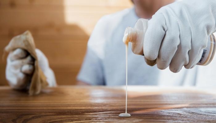 person polishing wood
