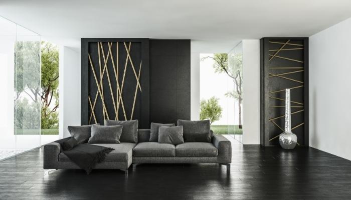 Dark grey couch in living room filled with contrasts