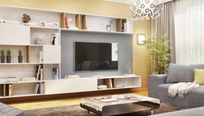 TV placed off-center in living room with U-shaped sectional and low-profile coffee table