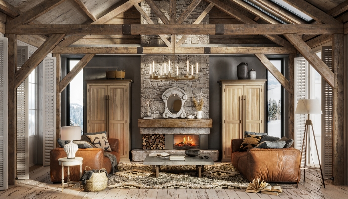 A rustic living room with a stone coffee table, leather sofas, and exposed wood elements