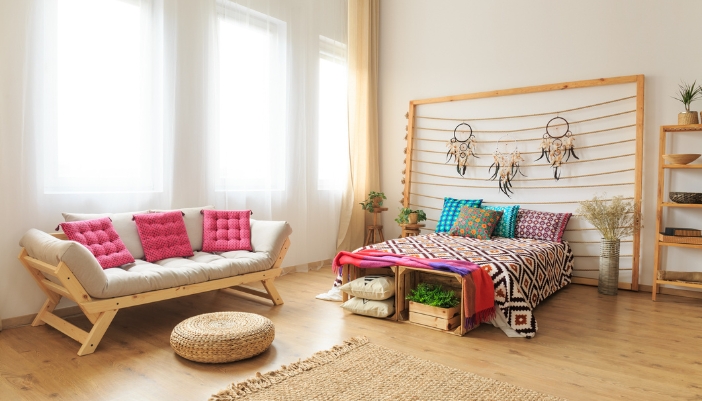 A bedroom with a mix of bold-colored patterns