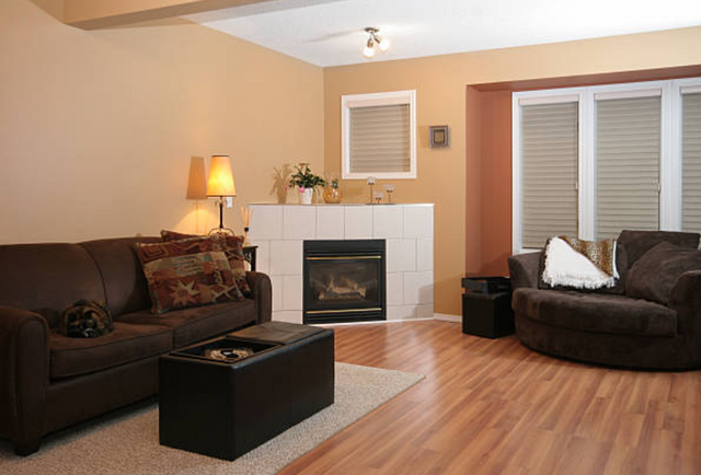 front view of a causal living room with an angled fireplace