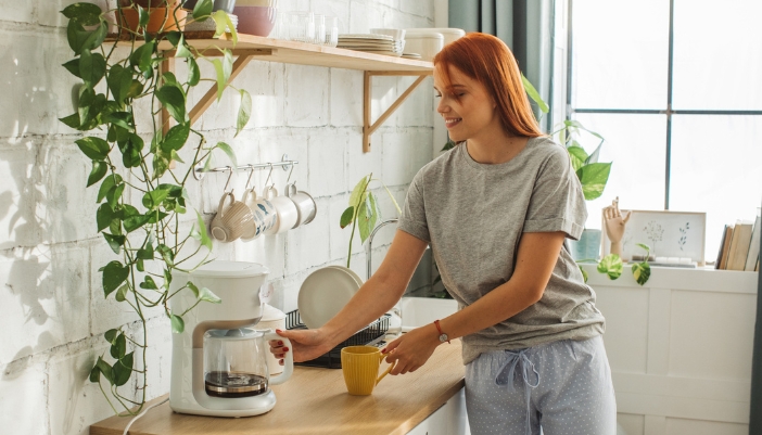 woman making coffee at home coffee bar 